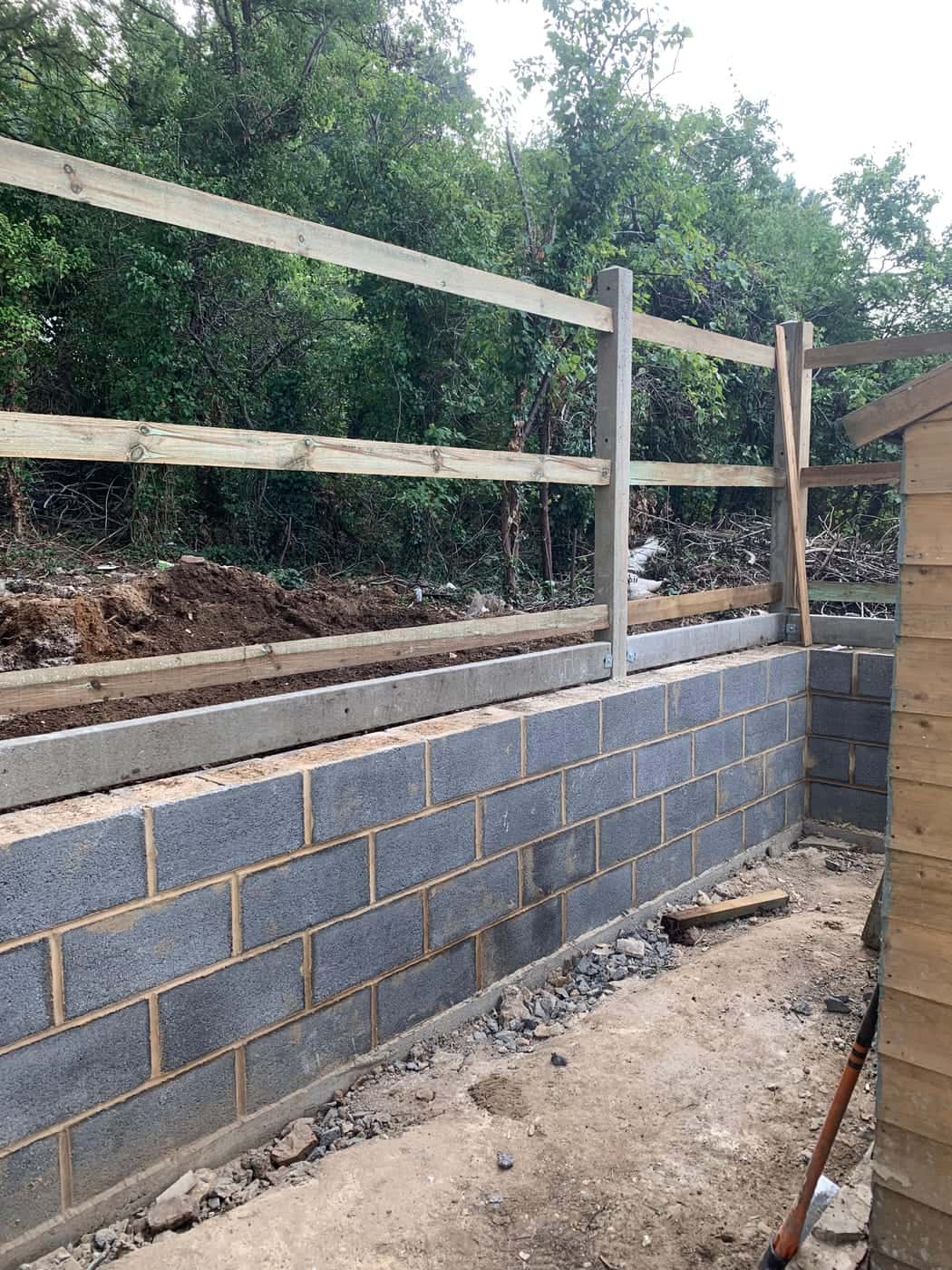 Blockwork retaining wall under construction