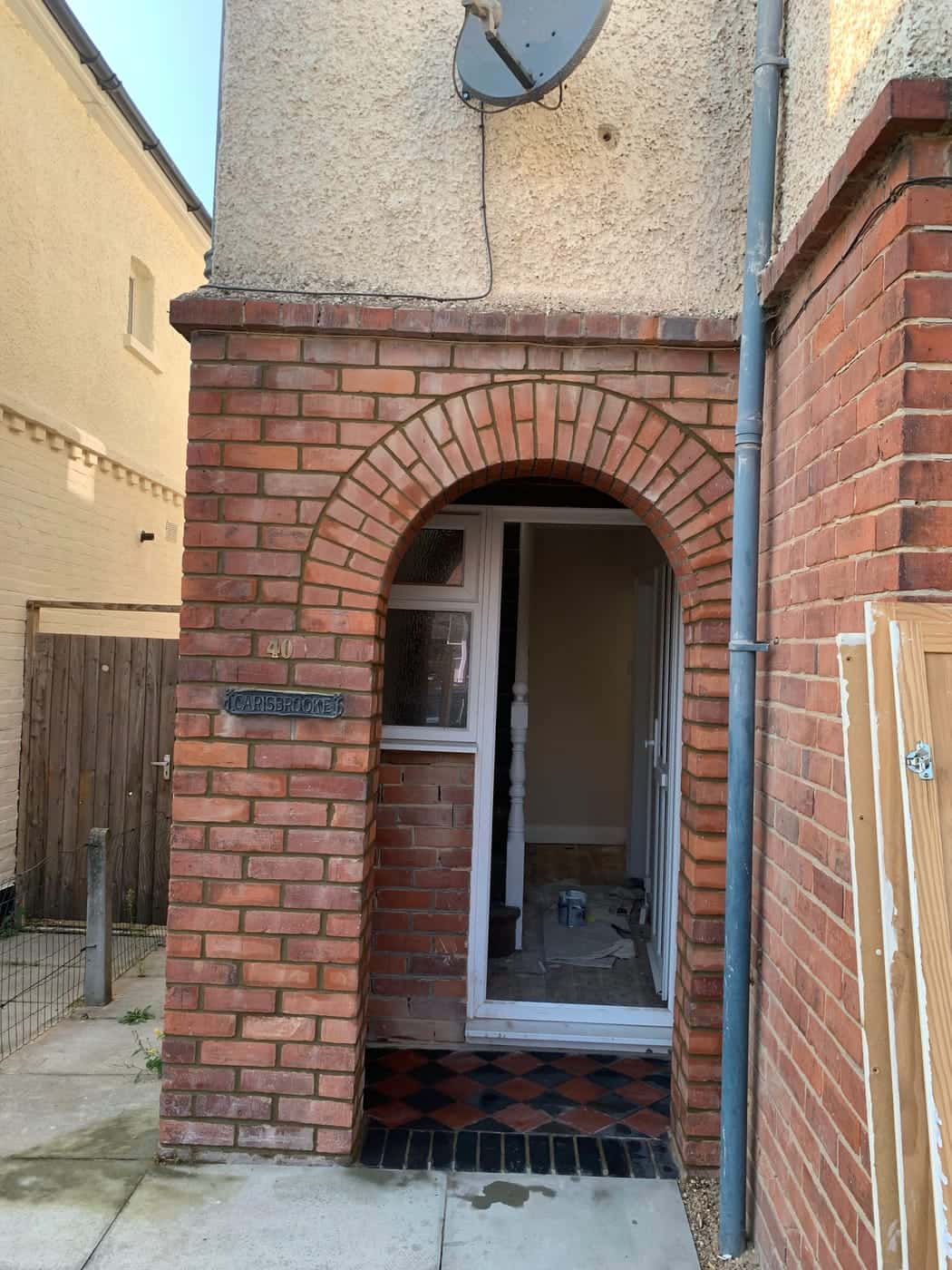 Brick-arched porch on the side of a house