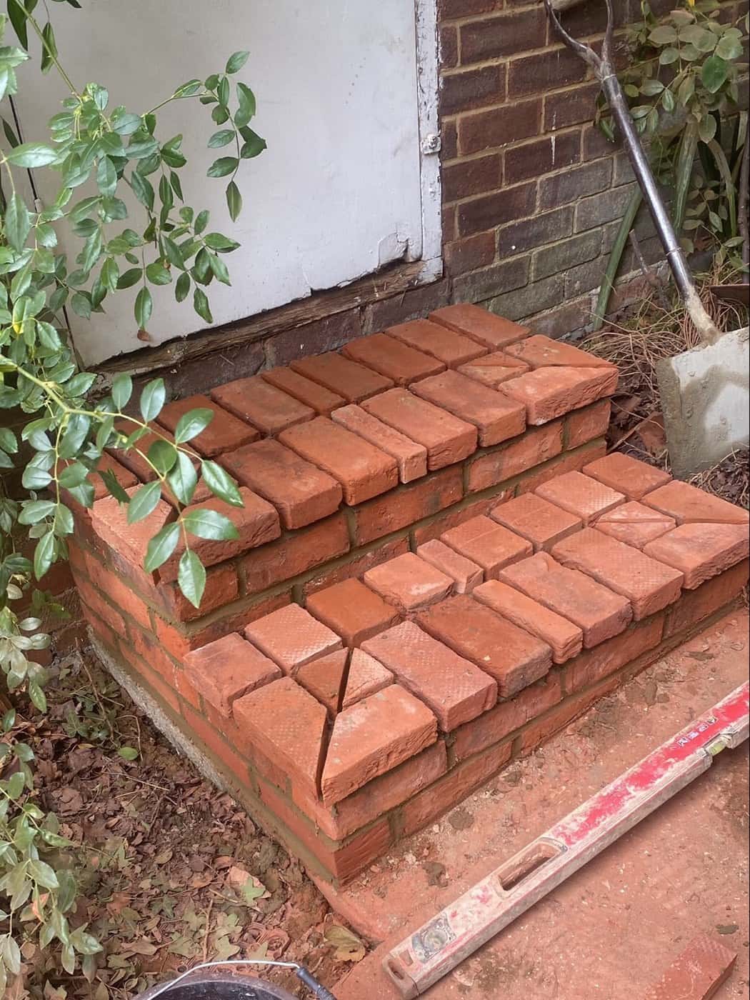 Newly built red-brick steps up to a door