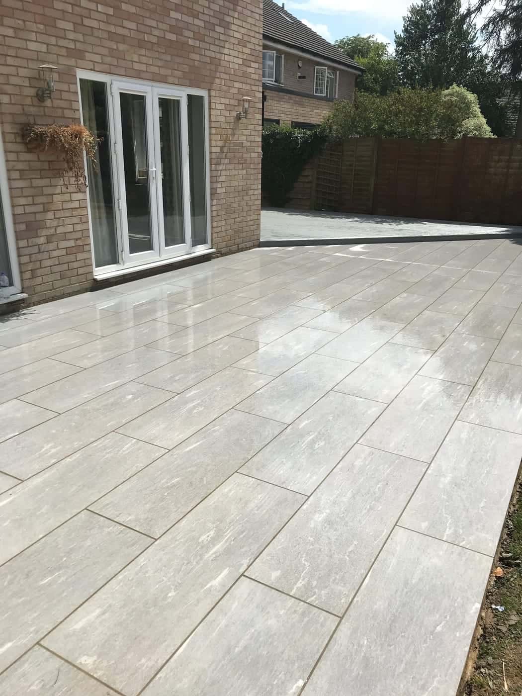 Porcelain-paved patio at the back of a house