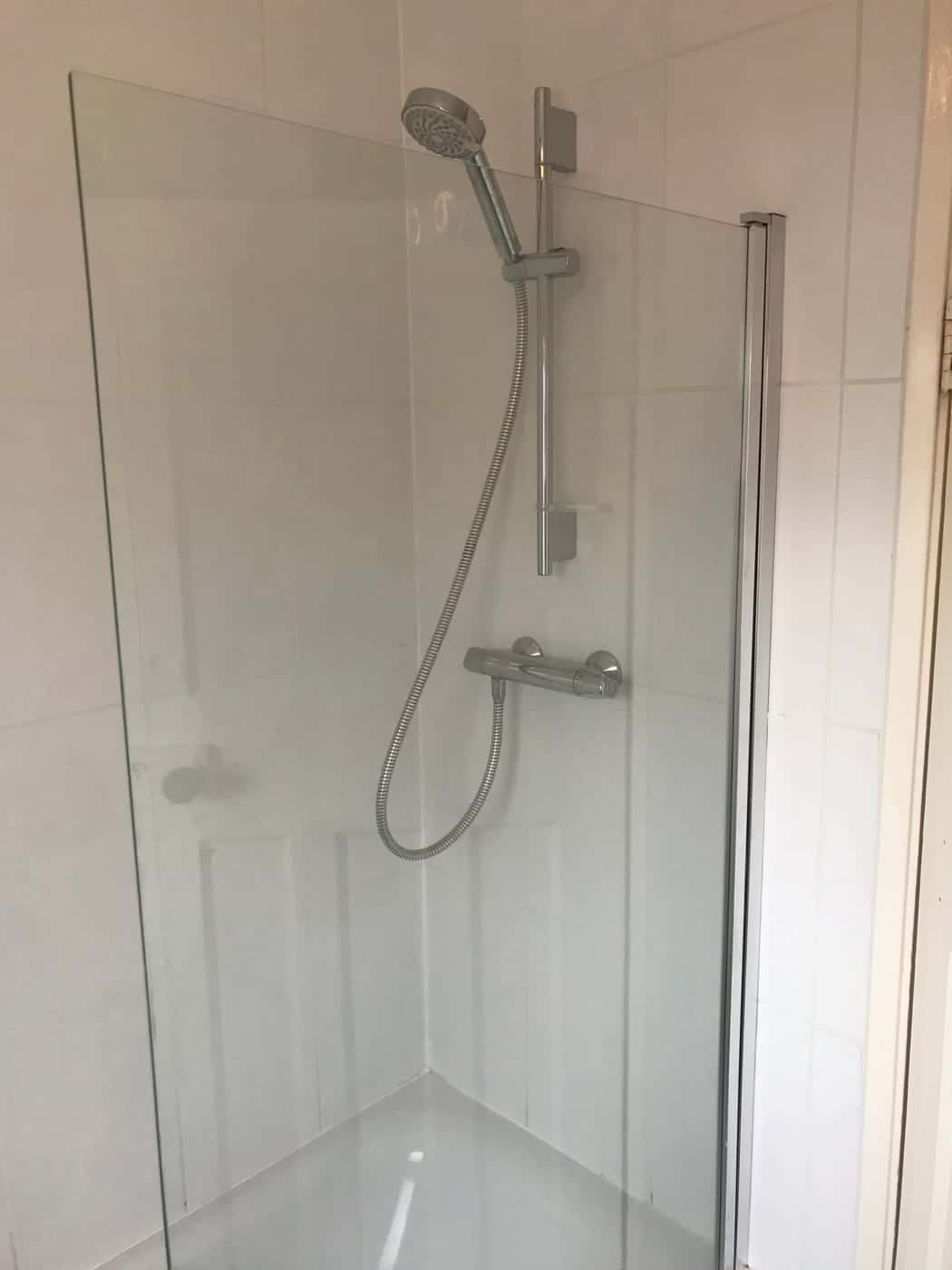 New shower enclosure with white wall panels